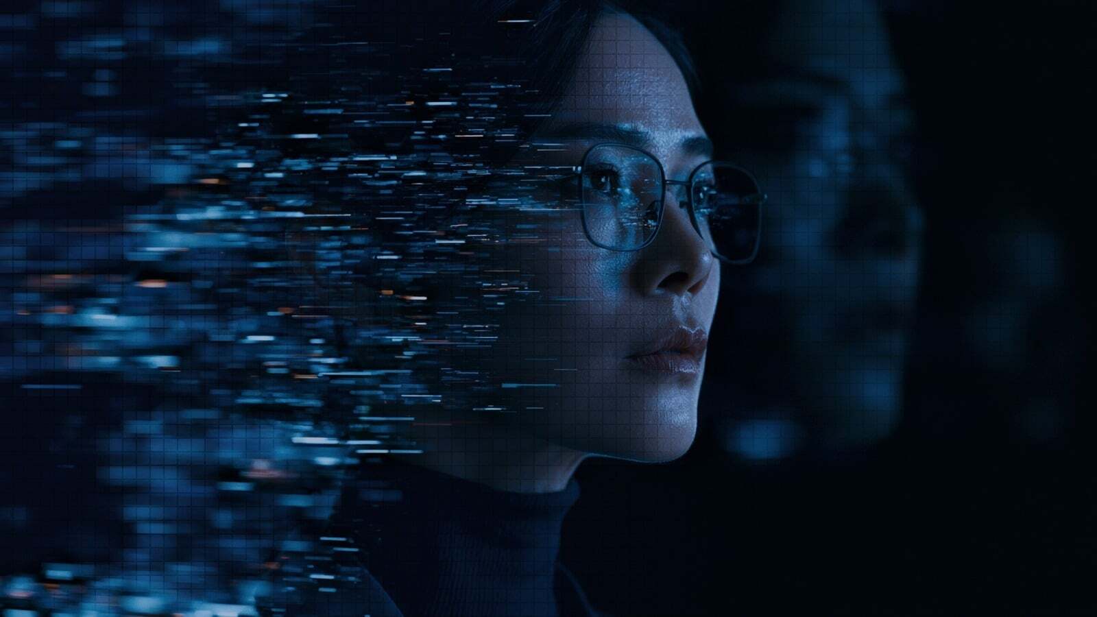A clinician in profile, her face dissolving into streams of blue data